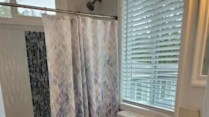 A bathroom with a toilet, shower, and sink. - Mountain View Retreat Unit 2 - highly rated on leading vacation rental sites! (Mountain View)