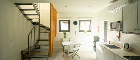 Fridge, microwave, stovetop, coffee/tea maker