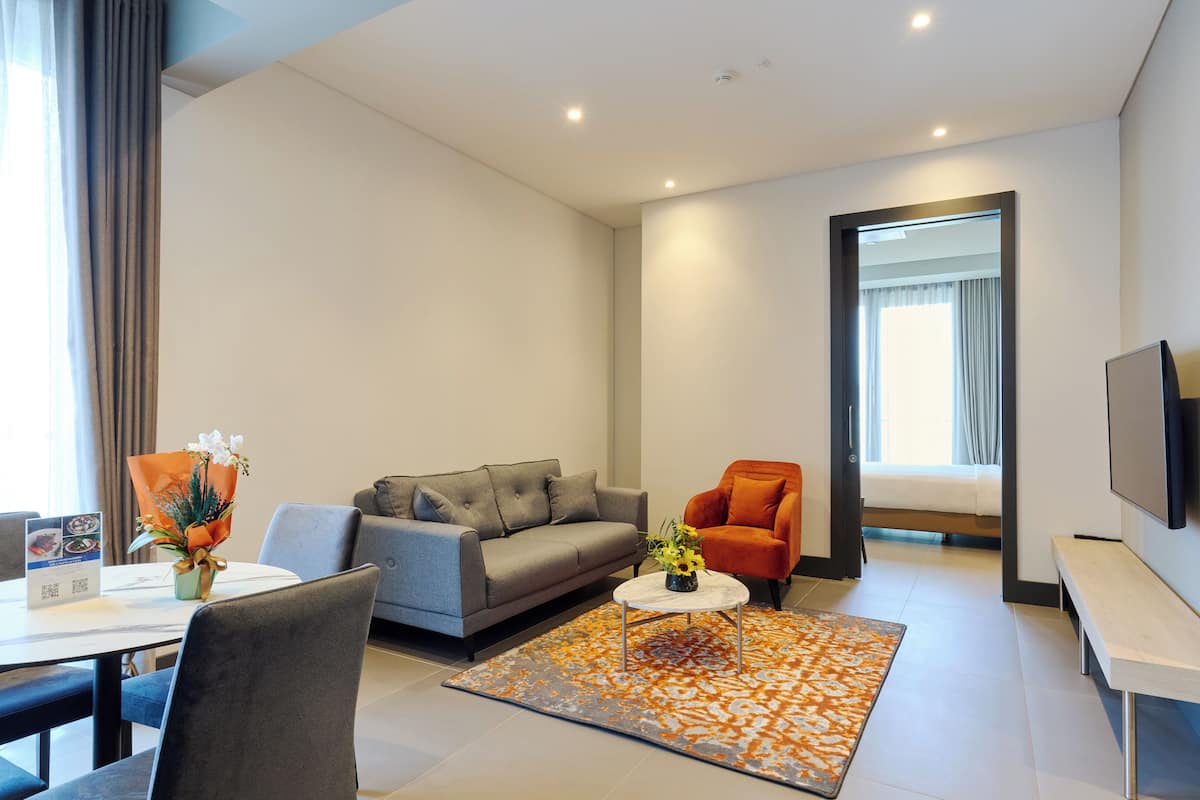 Family Suite, 2 Bedrooms | Living area | 55-inch flat-screen TV with satellite channels