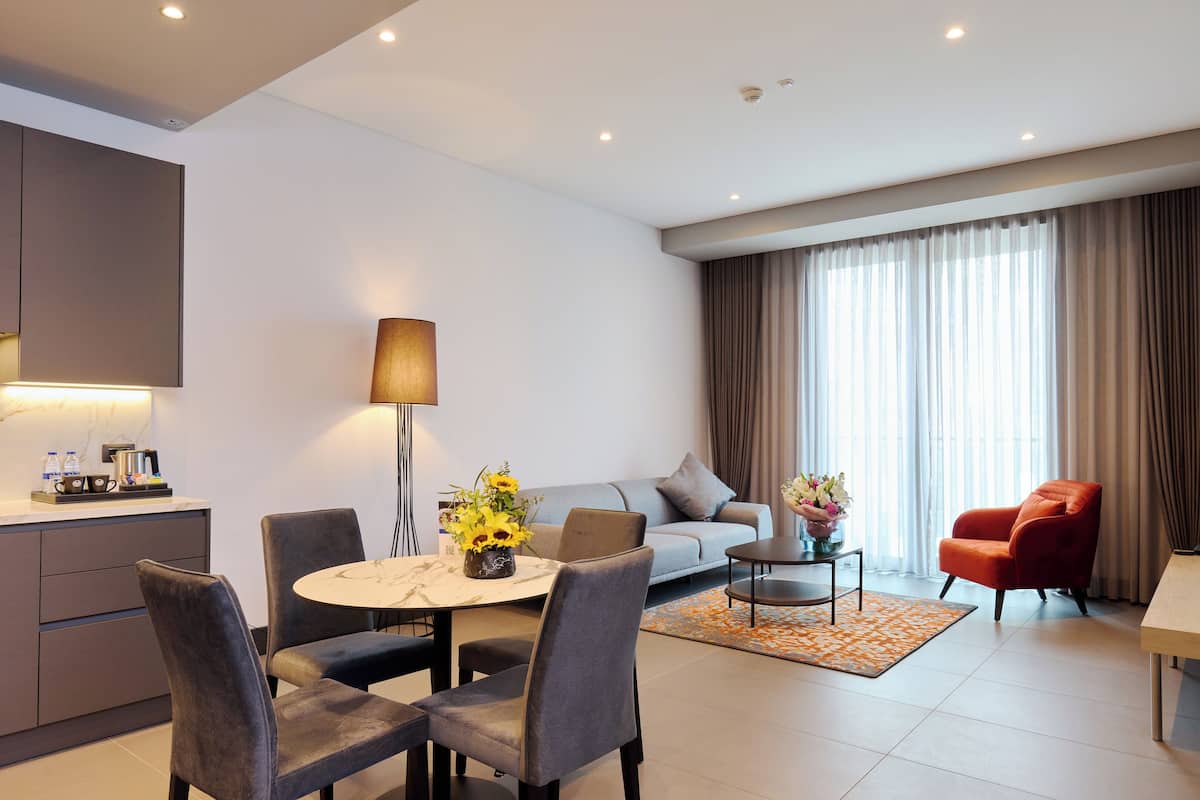 Suite, 1 Bedroom | Living area | 55-inch flat-screen TV with satellite channels