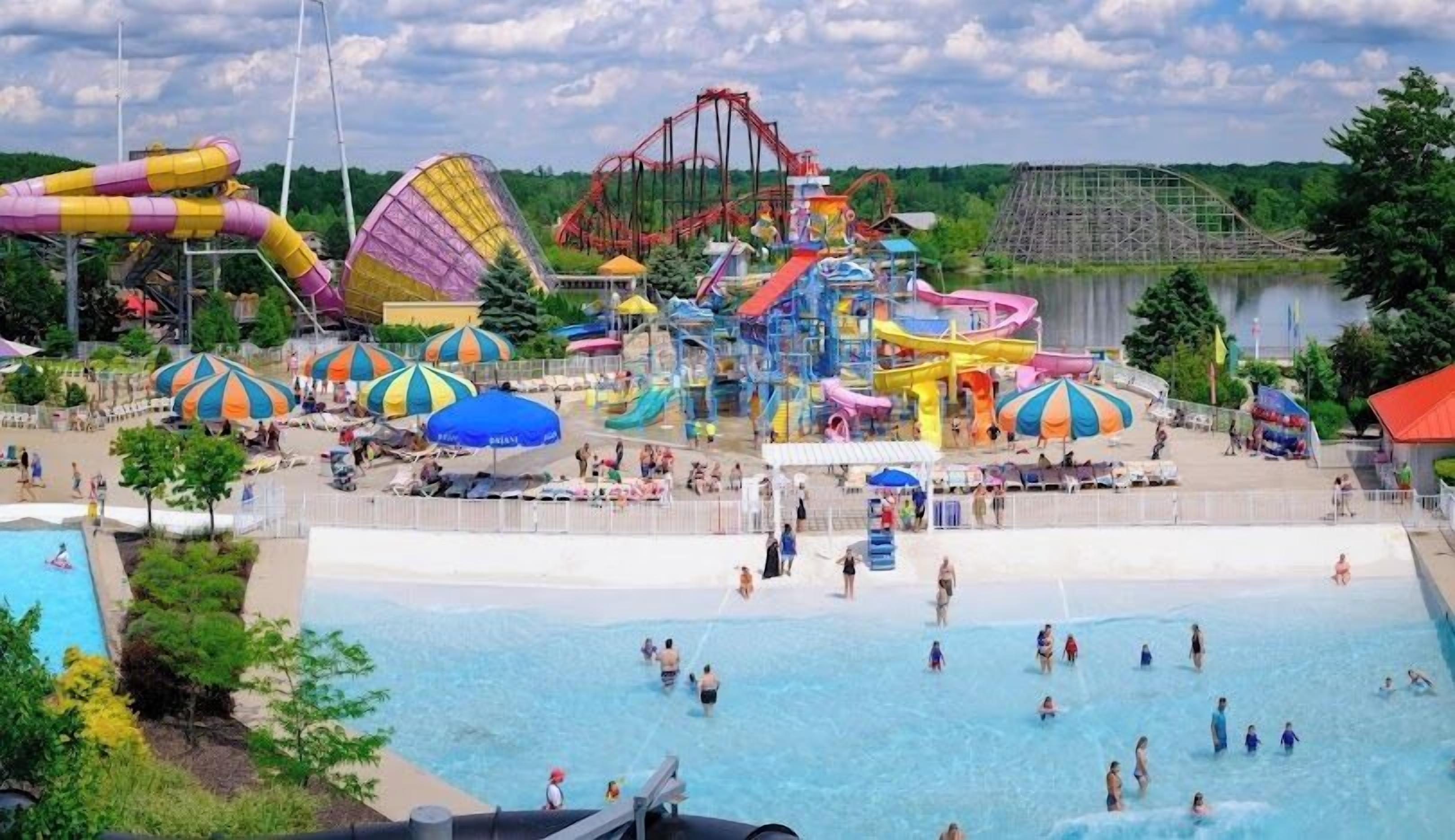 A water park with multiple slides, a wave pool, and a roller coaster.