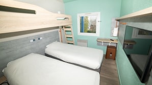 A compact room with bunk beds, a small window, a desk, and a chair. - Accueil Hotel Besançon (Besancon)