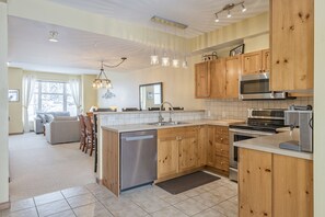 Fridge, microwave, oven, stovetop - 3 story townhome in Creekside with private hot tub, garage, close to village (Silver Star Mountain)