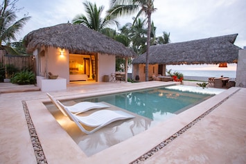 A saltwater pool anchors the property.
