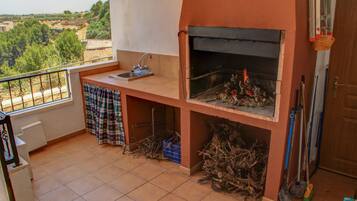 Enjoy al fresco dining on the balcony with a grill and sink.