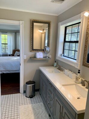 Shower, hair dryer, towels, toilet paper