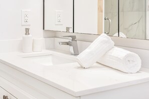 Jetted bath, hair dryer, towels, soap