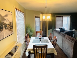 Enjoy meals with family and friends in this cozy dining area, complete with a table for four and comfortable seating.