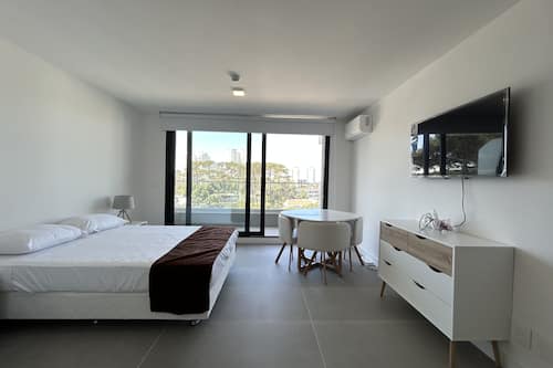 Superior Apartment | Living area | Flat-screen TV