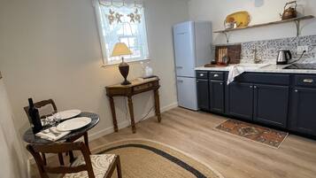Fridge, microwave, coffee/tea maker, cookware/dishes/utensils