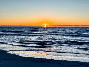 On the beach, sun-loungers, beach towels