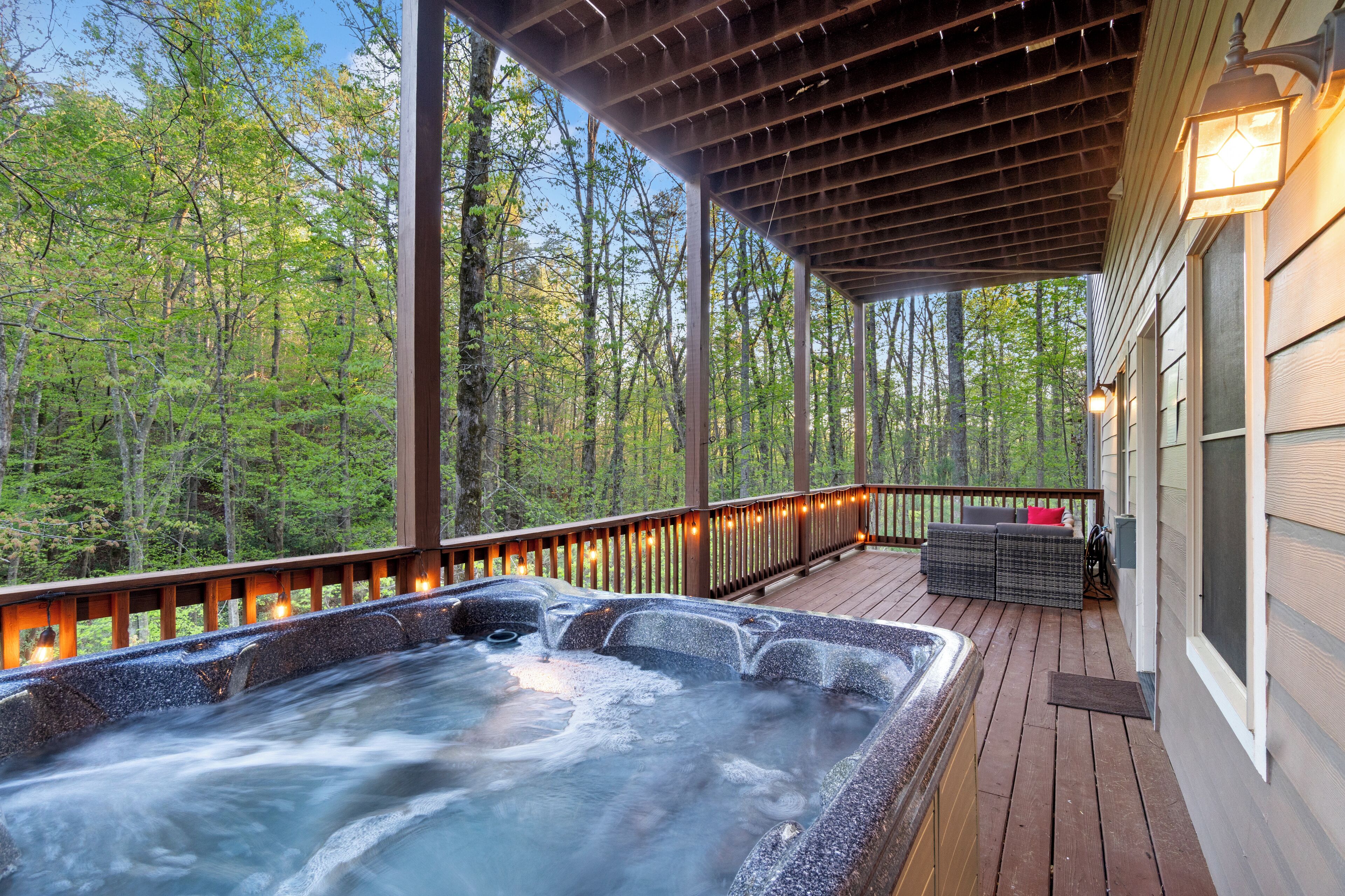 Kick back & relax in the private hot tub on the lower deck 