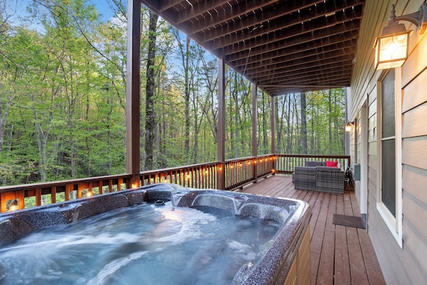 Kick back & relax in the private hot tub on the lower deck