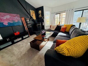 Smart TV, fireplace, books