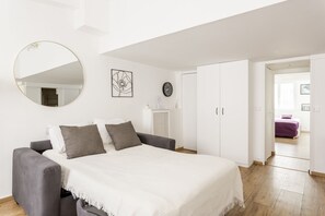 1 bedroom, desk, iron/ironing board, travel crib