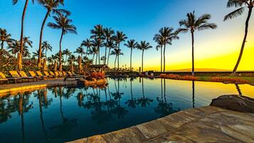 Outdoor pool, a waterfall pool, pool umbrellas, sun loungers