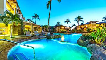 Outdoor pool, a waterfall pool, pool umbrellas, sun loungers