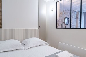 1 bedroom, desk, iron/ironing board, travel crib