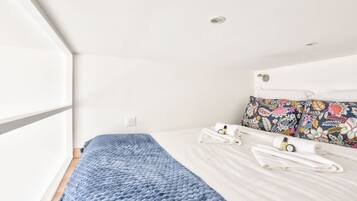 1 bedroom, desk, iron/ironing board, travel crib