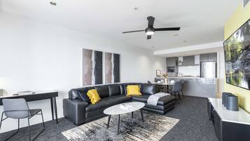 Apartment, 2 Bedrooms, Private Bathroom, River View | Living area | 24-inch flat-screen TV with cable channels