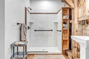 Shower, hair dryer, towels, shampoo
