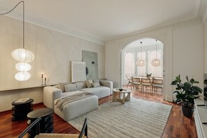 Relax in this inviting living area with a sofa, coffee table, and dining space for four.