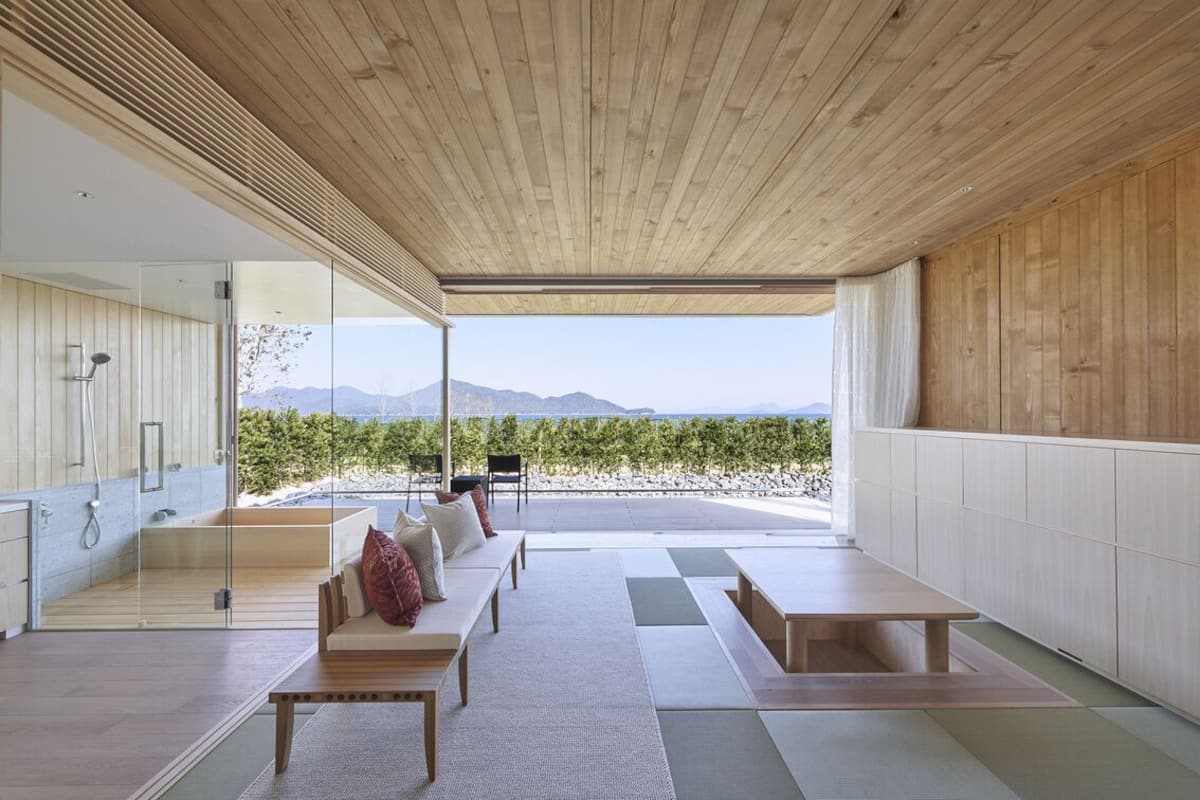 A modern outdoor seating area with a view of mountains.