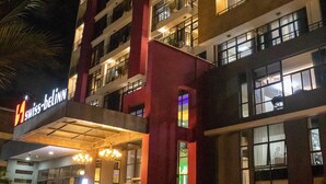 A multi-story hotel with a prominent entrance, balconies, and a well-lit facade. - Swiss-Belinn Nairobi (Nairobi)