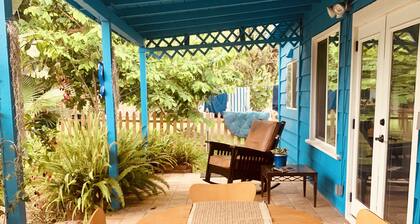 Charming beach cottage in a beautiful garden setting.