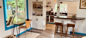 Charming beach cottage in a beautiful garden setting.