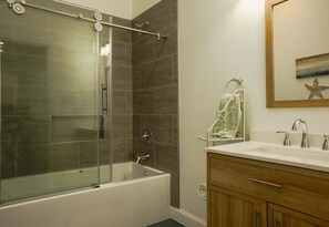 Shower, hair dryer, towels, toilet paper - Cozy Cowan Road Cottage- a feel of the Mississippi Gulf Coast.  (Gulfport)