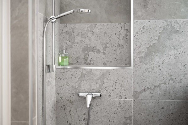Shower, hair dryer, towels, shampoo