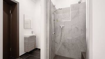 Shower, hair dryer, towels, shampoo