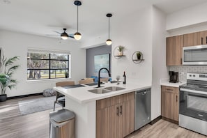 Fridge, microwave, oven, stovetop - The Well Retreat | Modern 1BR Near Tennis & Pickleball | Wellness Center (Zephyrhills)