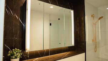 Shower, hair dryer, towels, soap