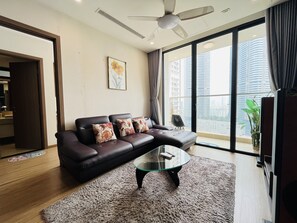 Luxury Apartment, 1 Bedroom | Living area | 50-inch Smart TV with cable channels, pay movies