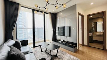 Panoramic Apartment, 2 Bedrooms | Living area | 50-inch Smart TV with cable channels, pay films