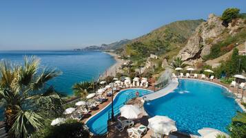 2 outdoor pools, pool umbrellas, pool loungers