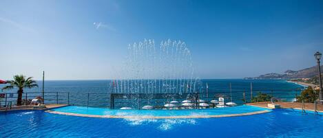 2 outdoor pools, pool umbrellas, pool loungers