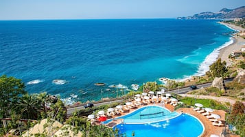 2 outdoor pools, pool umbrellas, pool loungers
