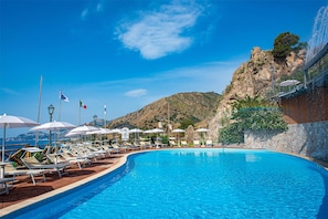 2 outdoor pools, pool umbrellas, pool loungers