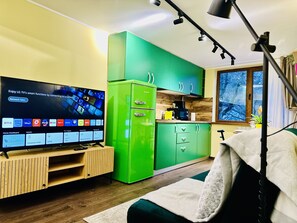 Appartement exécutif | Aire de séjour | Téléviseur
