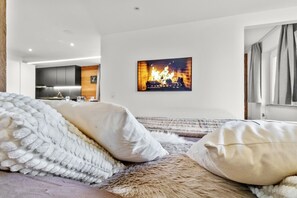 Tabla de planchar con plancha, wifi gratis y ropa de cama 