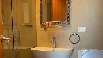 Shower, rainfall showerhead, bidet, towels