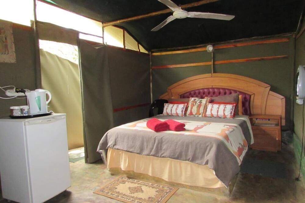 3 bed bush-tent under 3 trees, for couple plus chaperone. Free lion\/hyena sounds
