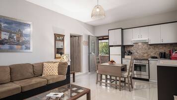 Cottage House | Living area | 50-inch flat-screen TV with digital channels, Netflix