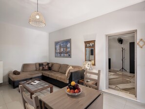 Cottage House | Living area | 50-inch flat-screen TV with digital channels, Netflix