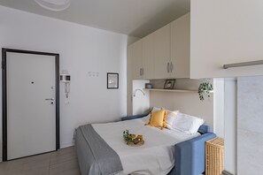 Planxa i posts de planxar, wifi gratuïta i roba de llit 