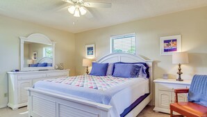 A bedroom with a bed, dresser, chair, and a ceiling fan. - Sebastian Home w/ Large Deck Near Golfing & Beach (Sebastian)