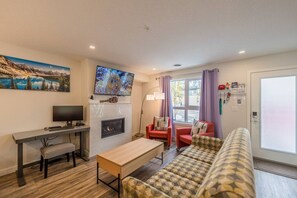 TV, fireplace - Skyline Getaway • Mountain Views • Pool • Hot Tub (Canmore)